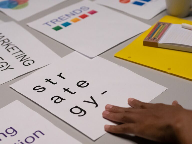 Person's Hand on White Paper